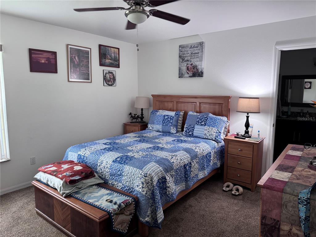 1855 North Berkley Road Avon Park, FL 33825 - Photo 12 of 28 a bedroom with a bed and furniture