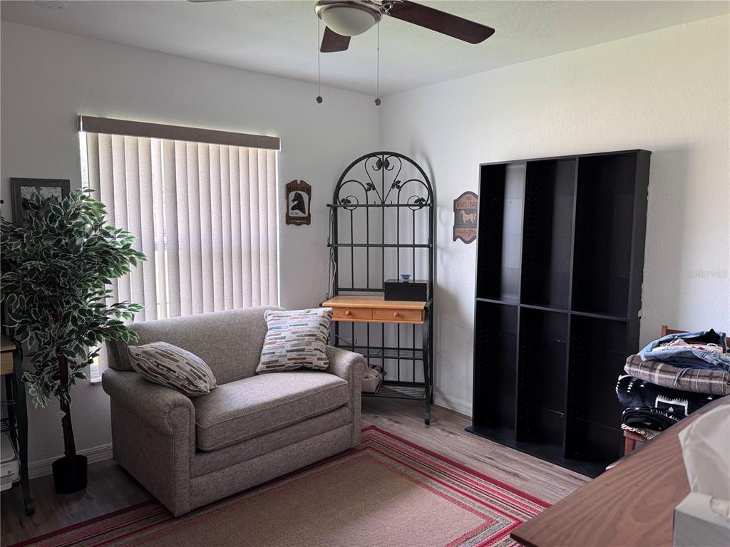 1855 North Berkley Road Avon Park, FL 33825 - Photo 20 of 28 a living room with furniture a window and entryway