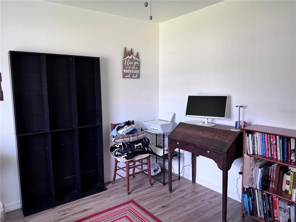 1855 North Berkley Road Avon Park, FL 33825 - Photo 21 of 28 a view of a workspace with furniture and wooden floor