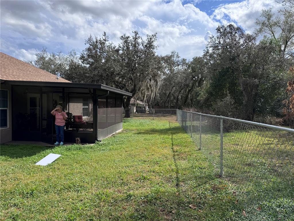 1855 North Berkley Road Avon Park, FL 33825 - Photo 27 of 28 a view of a backyard with sitting area and tub