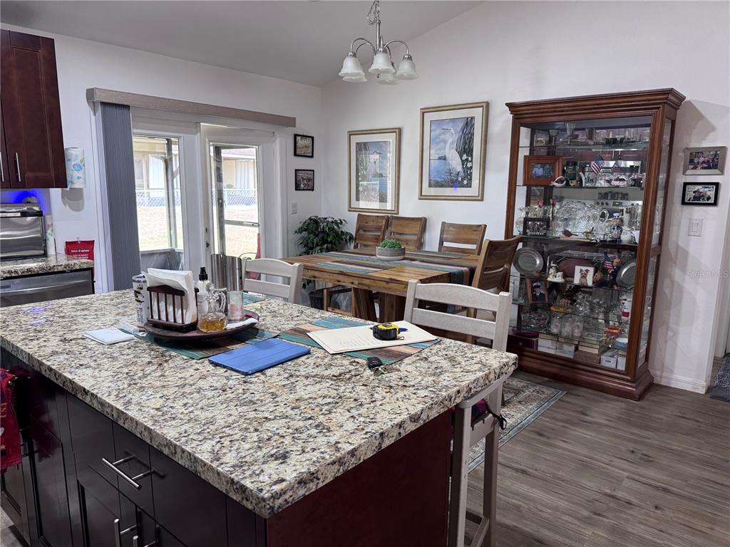 1855 North Berkley Road Avon Park, FL 33825 - Photo 8 of 28 a living room with granite countertop furniture and wooden floor