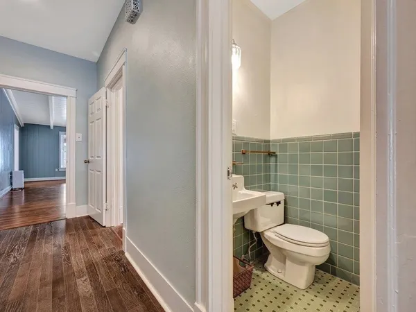 a bathroom with a toilet and a shower