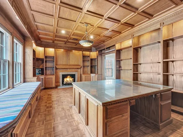 an old fashioned kitchen with a sink and wooden floor