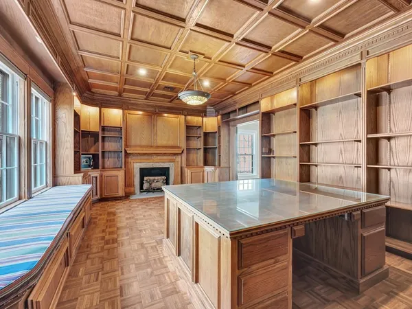 an old fashioned kitchen with a sink and wooden floor