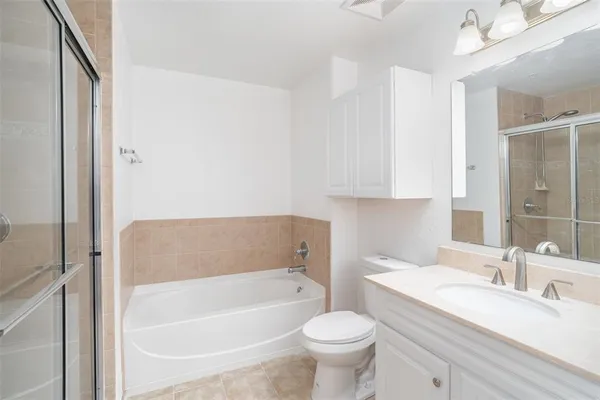 a bathroom with a sink a toilet and bathtub