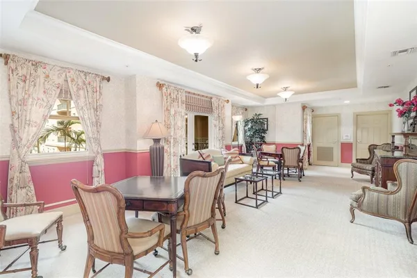 a view of a chairs and table in the patio