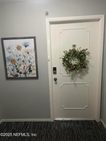 a bathroom with a sink a toilet and a large mirror
