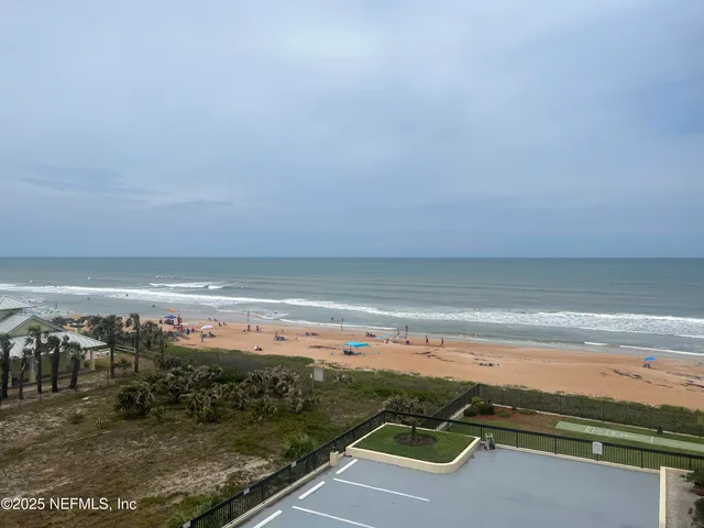 a kitchen with stainless steel appliances granite countertop a refrigerator and a stove