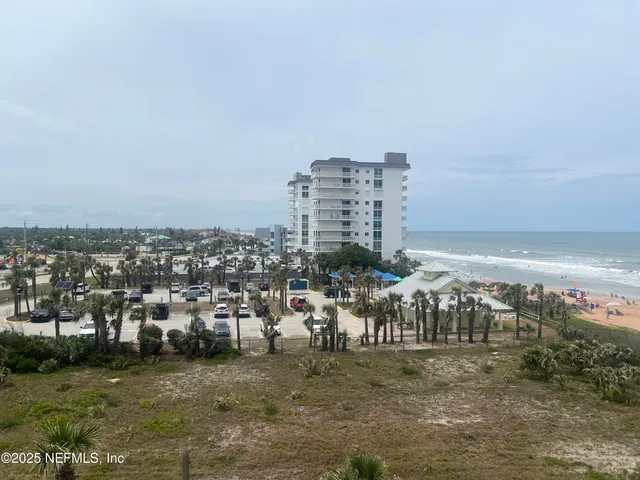 a kitchen with sink refrigerator and cabinets