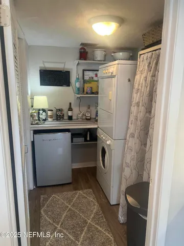 a living room with furniture and flowers