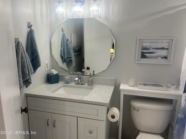 a view of a dining room with furniture and window