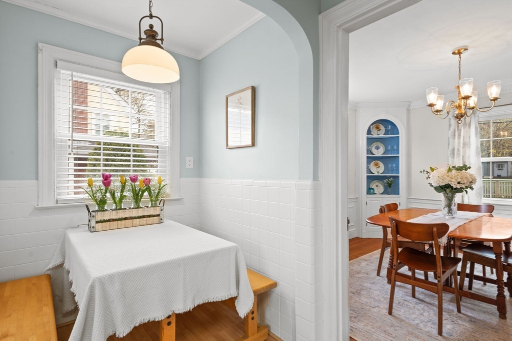 6 Tower Avenue Needham, MA 02494 - Photo 12 of 43 a view of a dining room with furniture and a chandelier