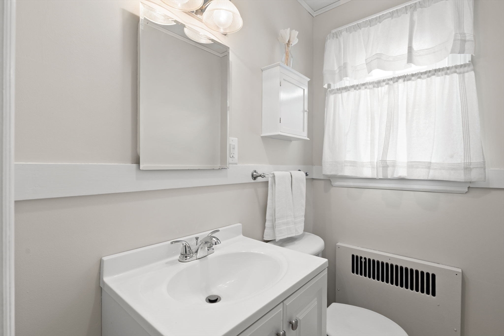 6 Tower Avenue Needham, MA 02494 - Photo 14 of 43 a bathroom with a sink a toilet and a mirror