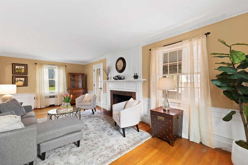 6 Tower Avenue Needham, MA 02494 - Photo 20 of 43 a living room with furniture a fireplace and a potted plant