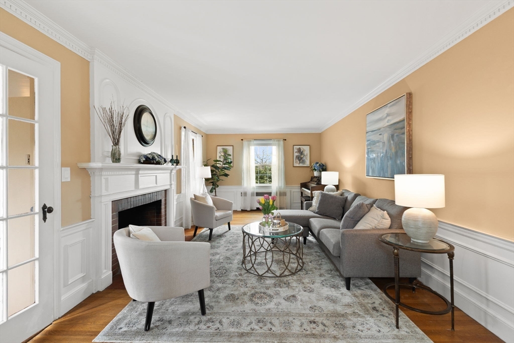 6 Tower Avenue Needham, MA 02494 - Photo 23 of 43 a living room with furniture and a fireplace