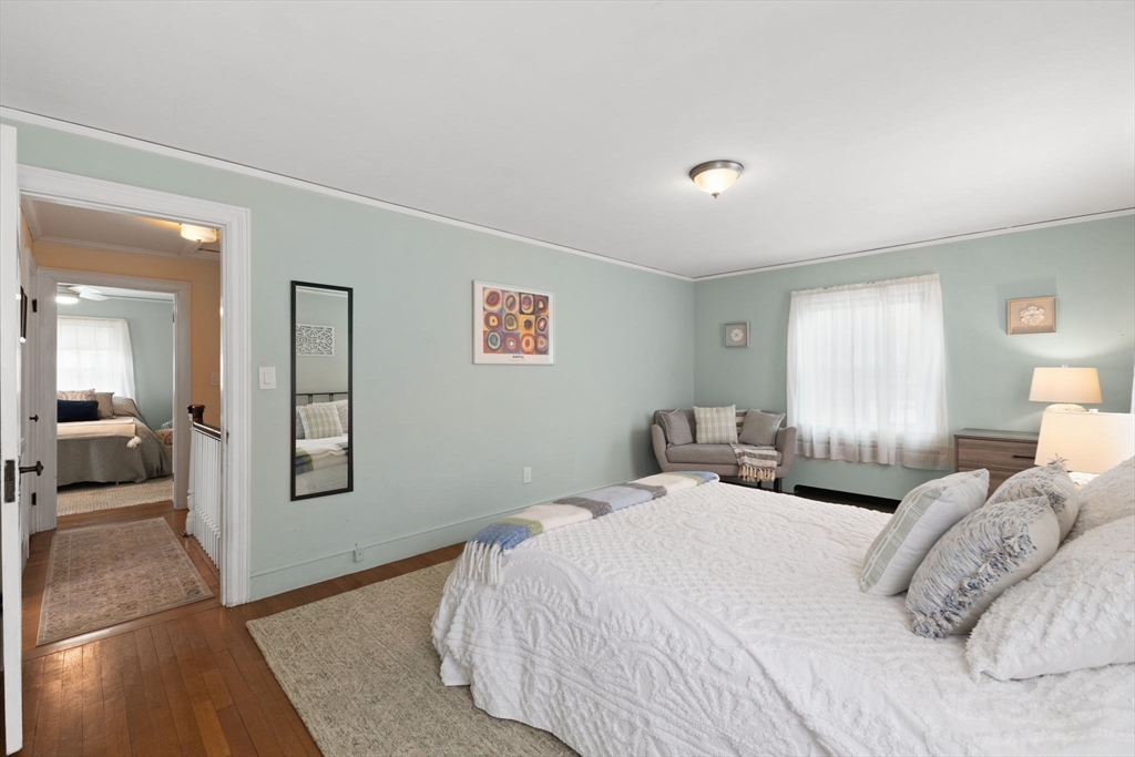 6 Tower Avenue Needham, MA 02494 - Photo 29 of 43 a bedroom with a large bed and a couch