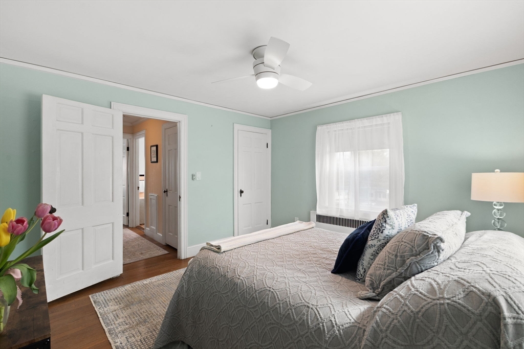 6 Tower Avenue Needham, MA 02494 - Photo 35 of 43 a bedroom with a bed and a chandelier