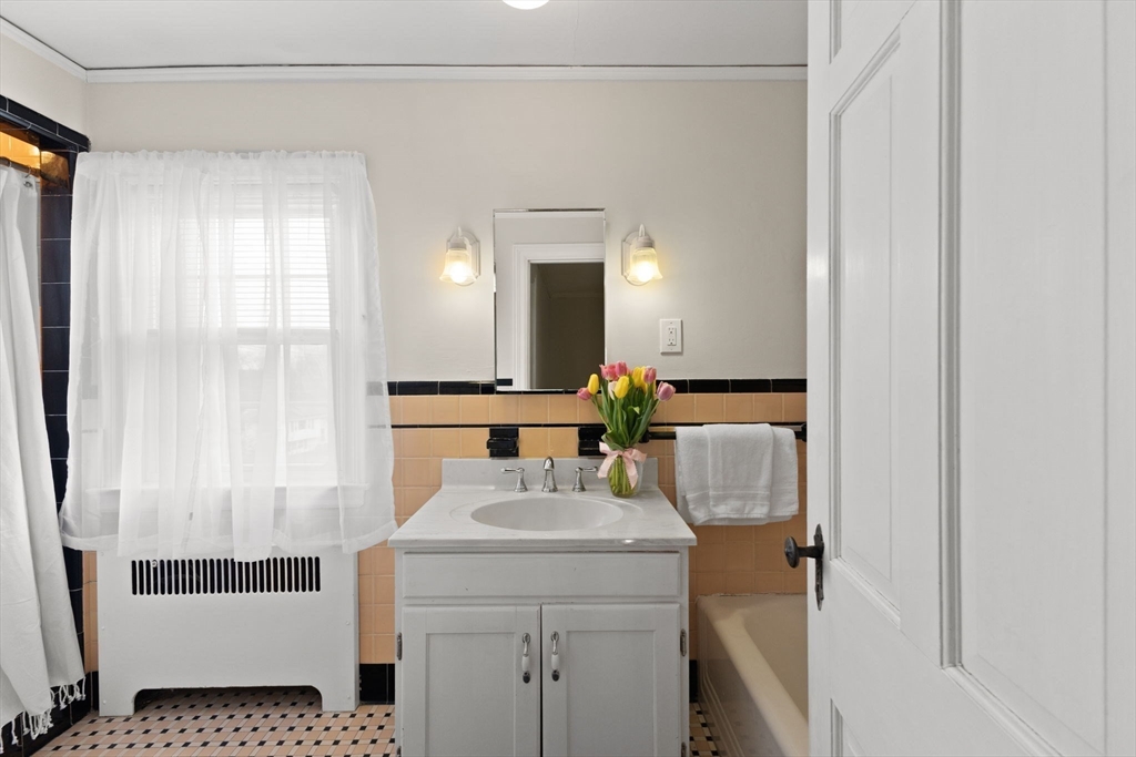 6 Tower Avenue Needham, MA 02494 - Photo 36 of 43 a bathroom with a sink and a mirror