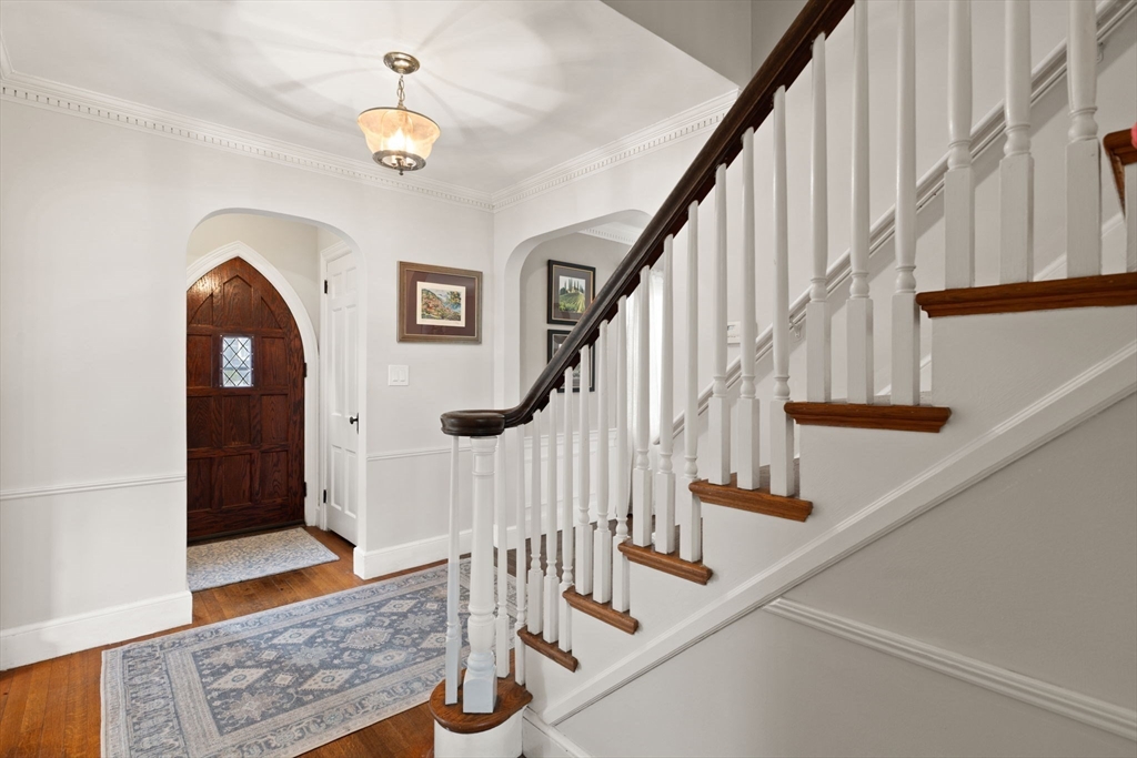 6 Tower Avenue Needham, MA 02494 - Photo 4 of 43 a view of staircase with wooden floor and a rug