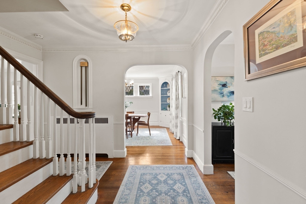 6 Tower Avenue Needham, MA 02494 - Photo 5 of 43 a view of a hallway with wooden floor and staircase