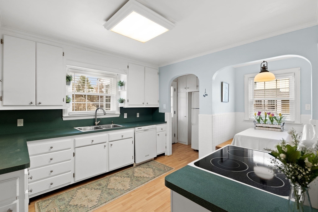 6 Tower Avenue Needham, MA 02494 - Photo 6 of 43 a kitchen with sink and cabinets