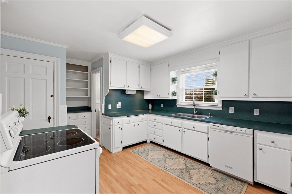 6 Tower Avenue Needham, MA 02494 - Photo 9 of 43 a kitchen that has a sink and a stove in it