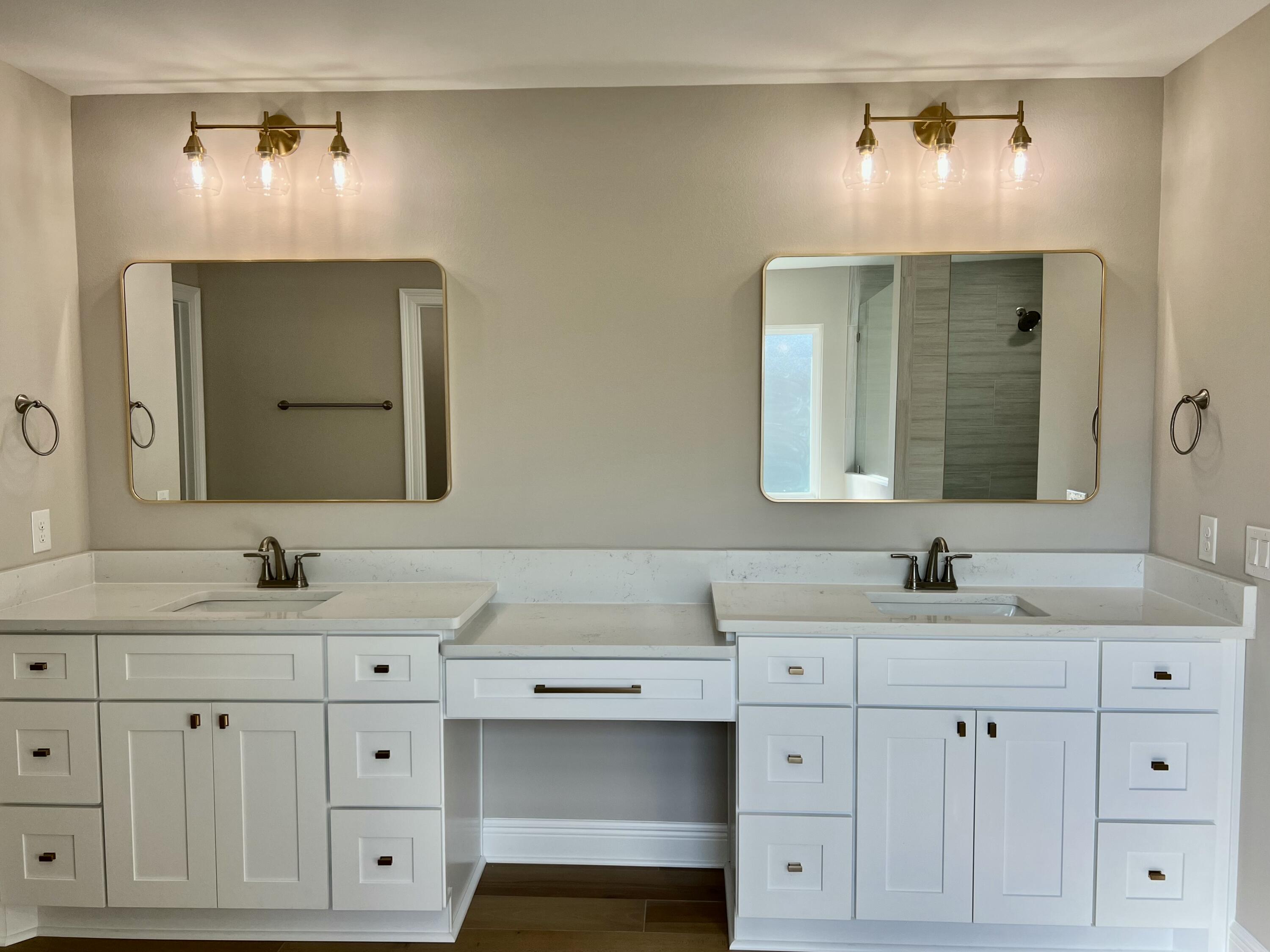 2038 Colby Court Navarre, FL 32566 - Photo 18 of 51 a bathroom with a double vanity sink and mirror