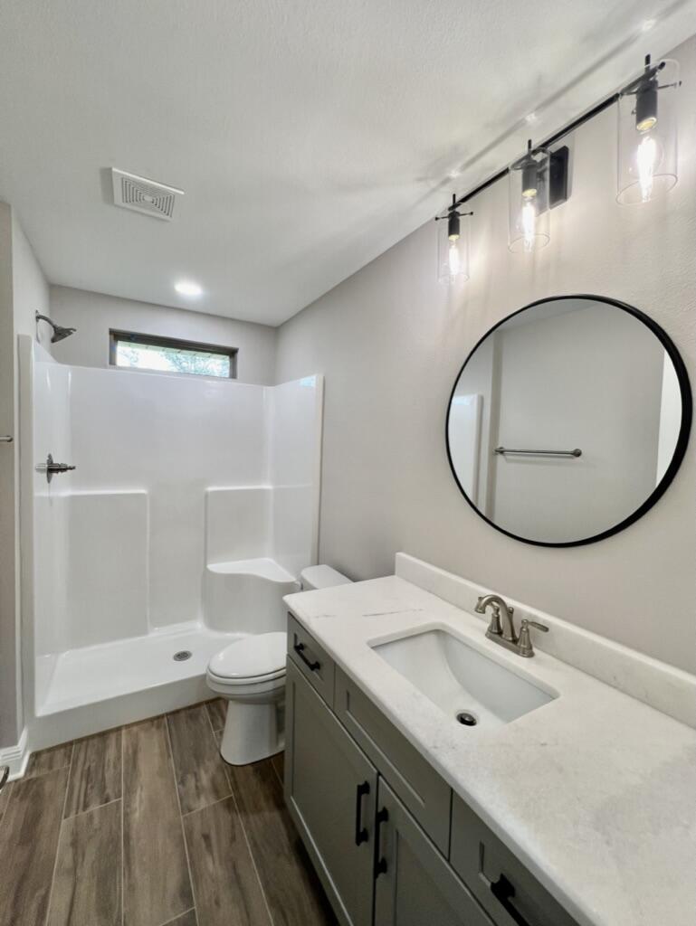 2038 Colby Court Navarre, FL 32566 - Photo 26 of 51 a bathroom with a sink and a mirror