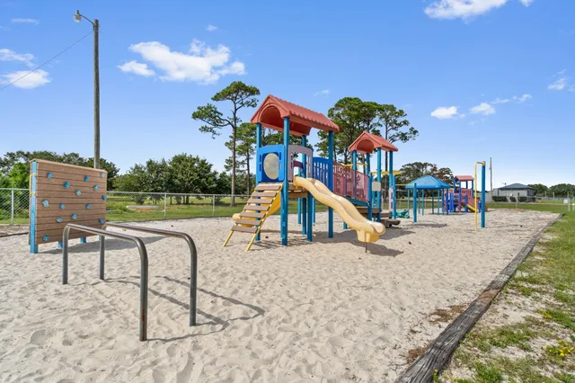 swimming pool with outdoor seating and yard