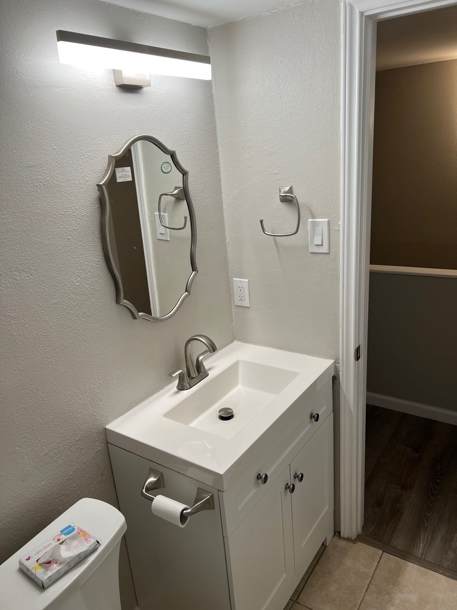 2413 Leon Street, Unit 103 Austin, TX 78705 - Photo 14 of 15 a bathroom with a toilet sink and mirror