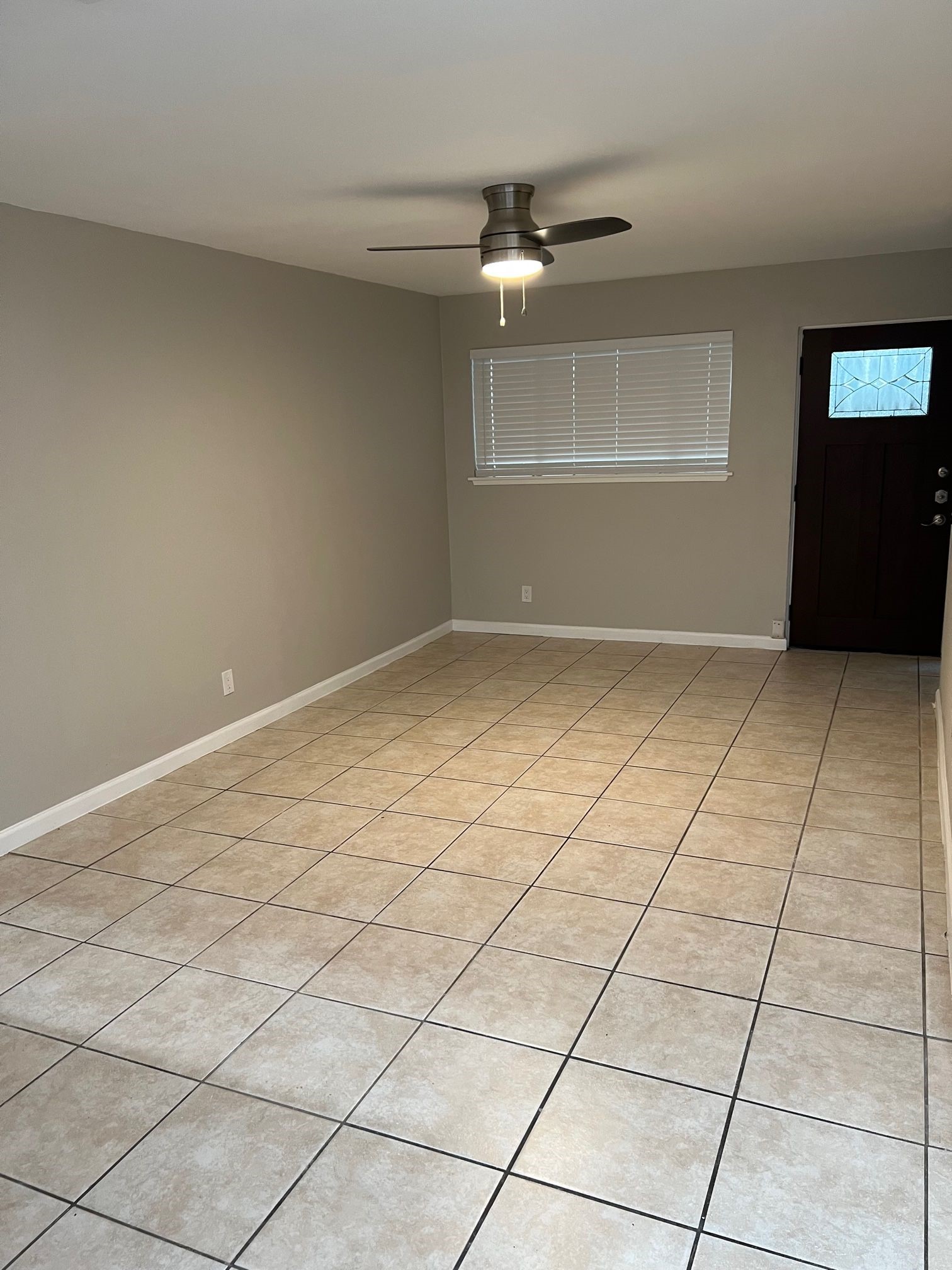 2413 Leon Street, Unit 103 Austin, TX 78705 - Photo 3 of 15 a view of an empty room with a window