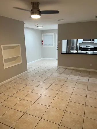 a view of an empty room and window