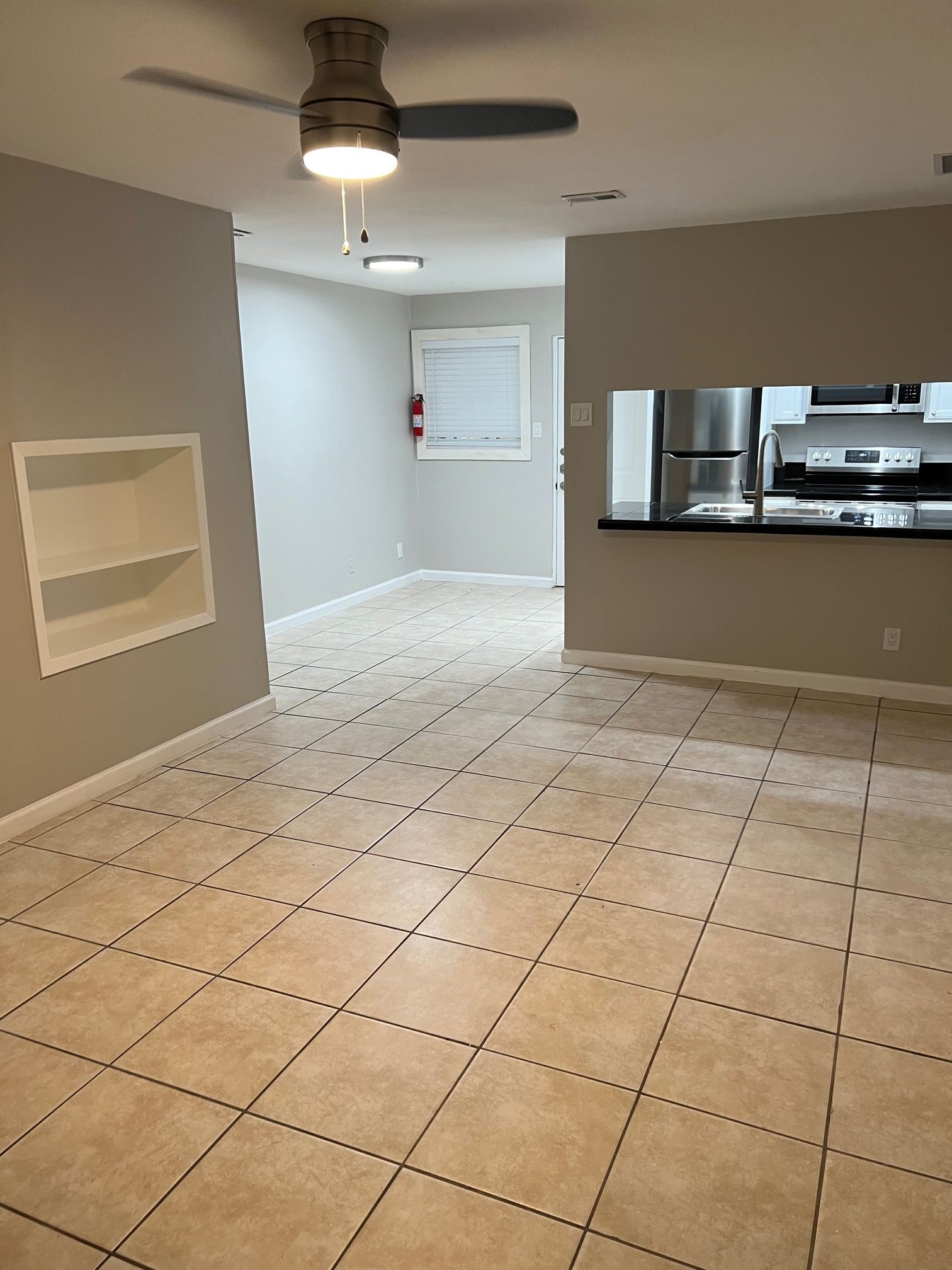 2413 Leon Street, Unit 103 Austin, TX 78705 - Photo 4 of 15 a view of an empty room and window