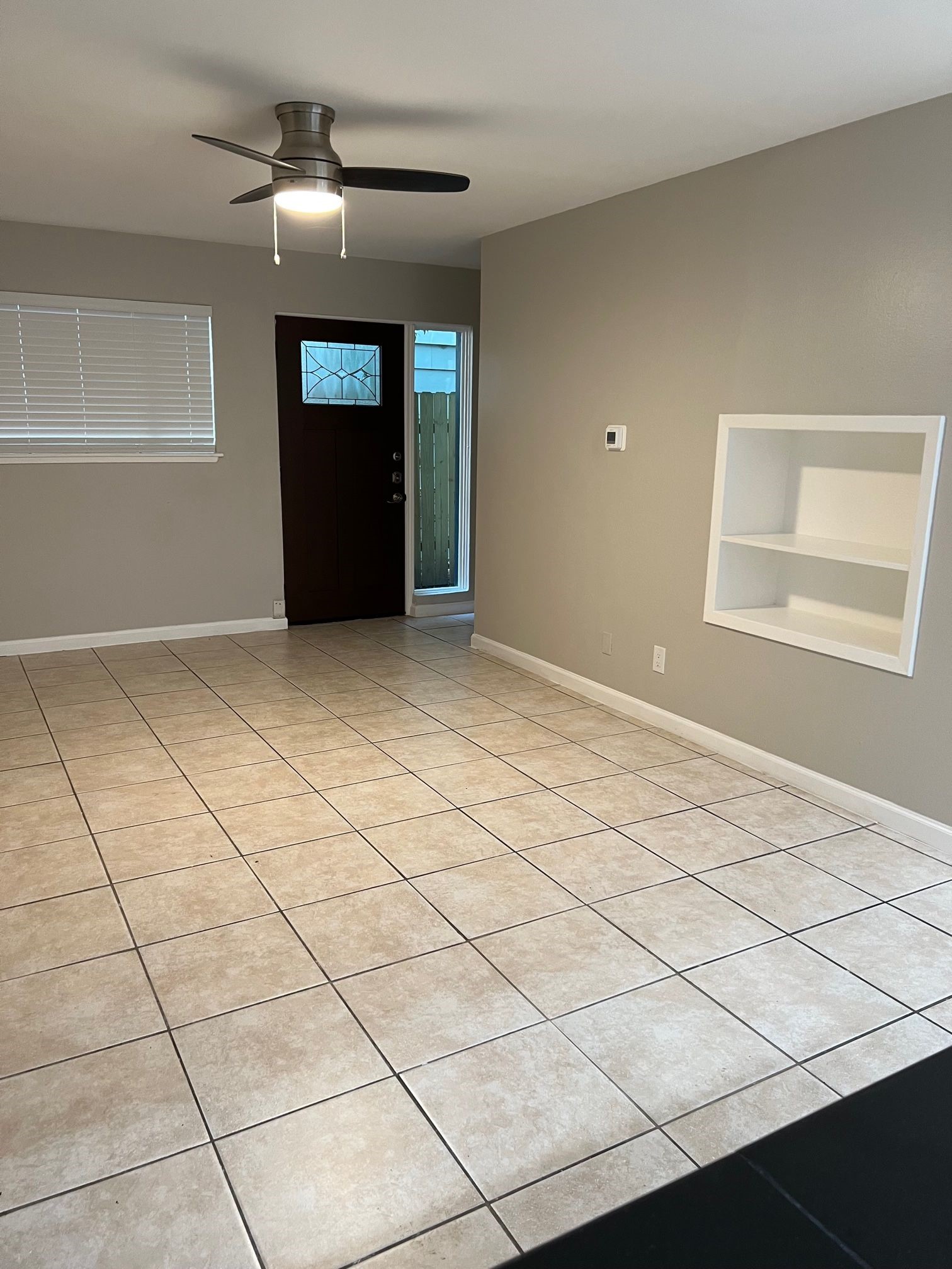 2413 Leon Street, Unit 103 Austin, TX 78705 - Photo 6 of 15 a view of an empty room with a window