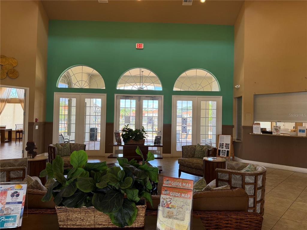 4573 Ada Lane Kissimmee, FL 34746 - Photo 35 of 37 a living room with furniture and a large window