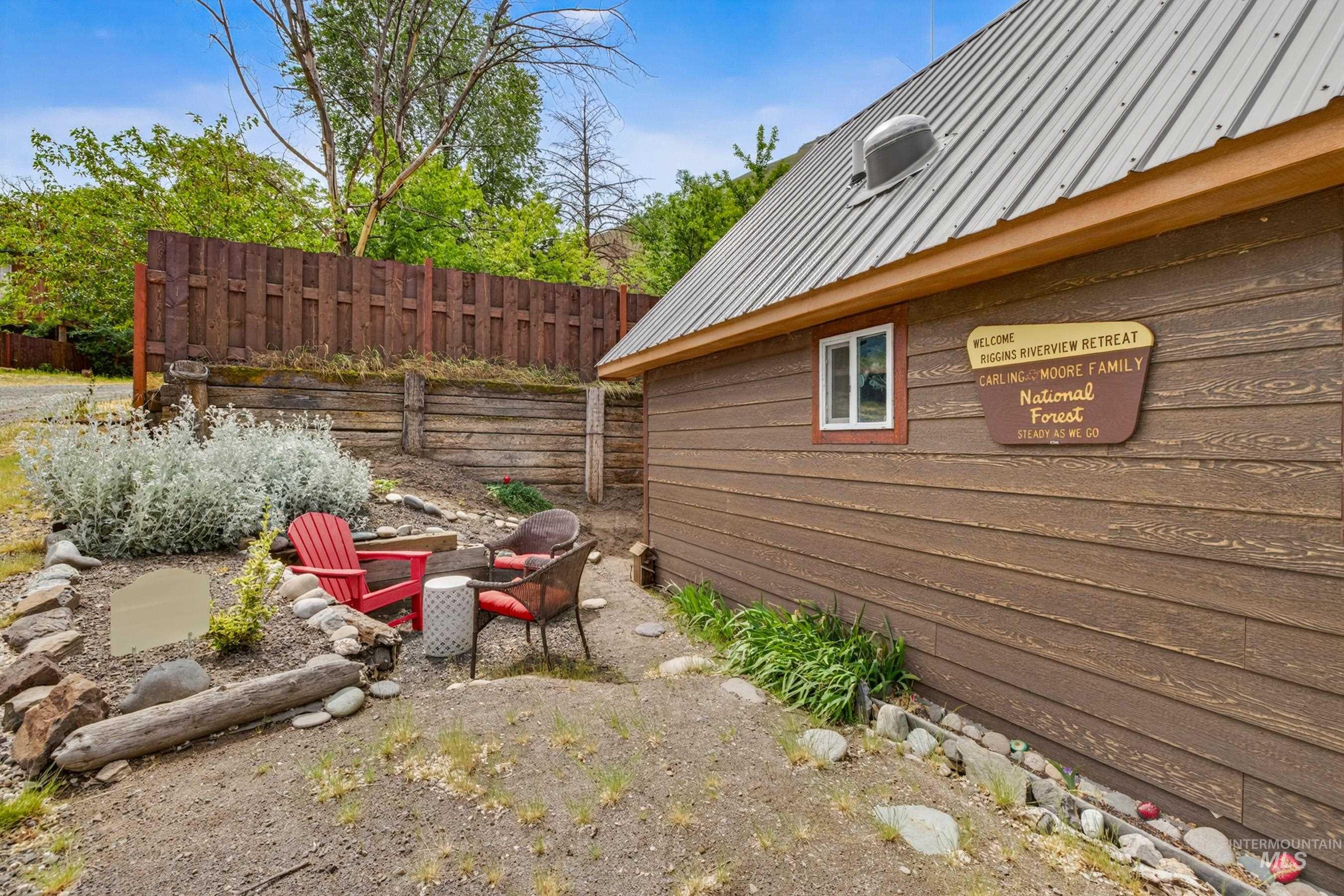1432 Salmon Drive Riggins, ID 83549 - Photo 27 of 39 Exterior siding with horizontal paneling and a metal roof