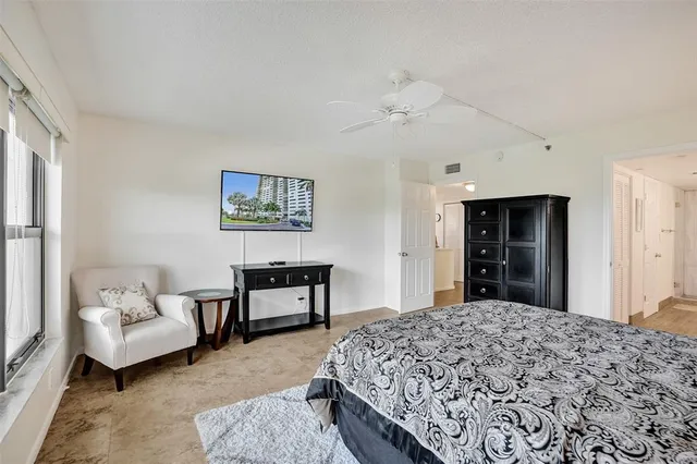 a bedroom with furniture and window