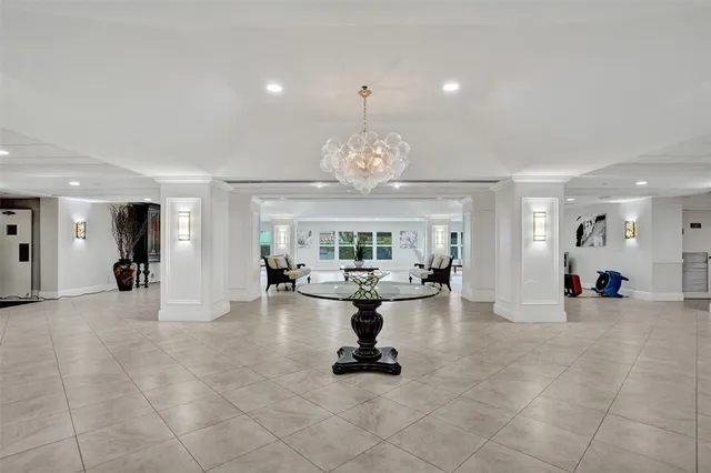 a view of a living room and chandelier