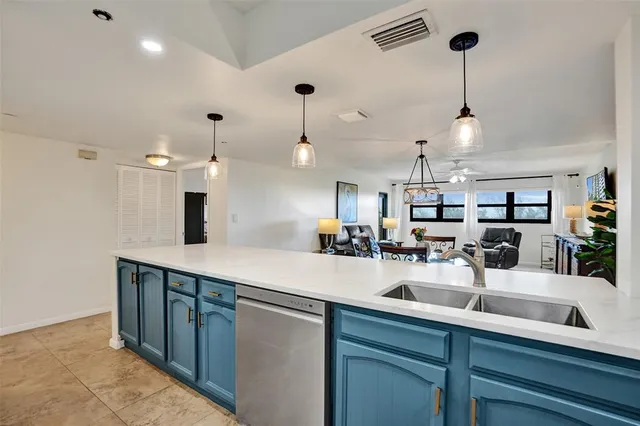 a kitchen with lots of counter space and a sink
