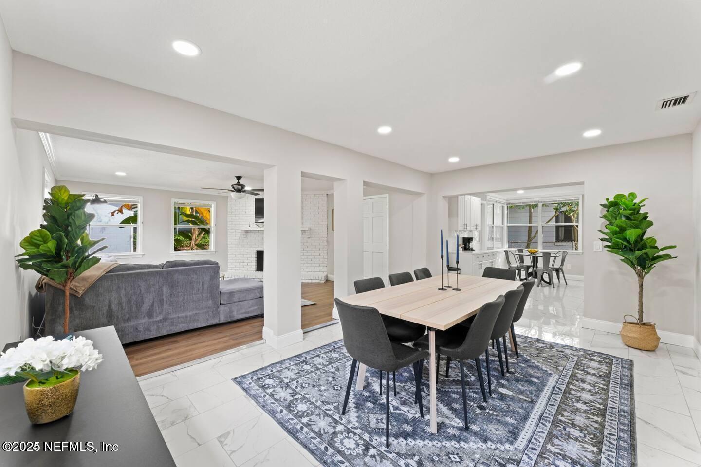 1247 Rensselaer Avenue Jacksonville, FL 32205 - Photo 11 of 24 a view of a dining room with furniture and wooden floor