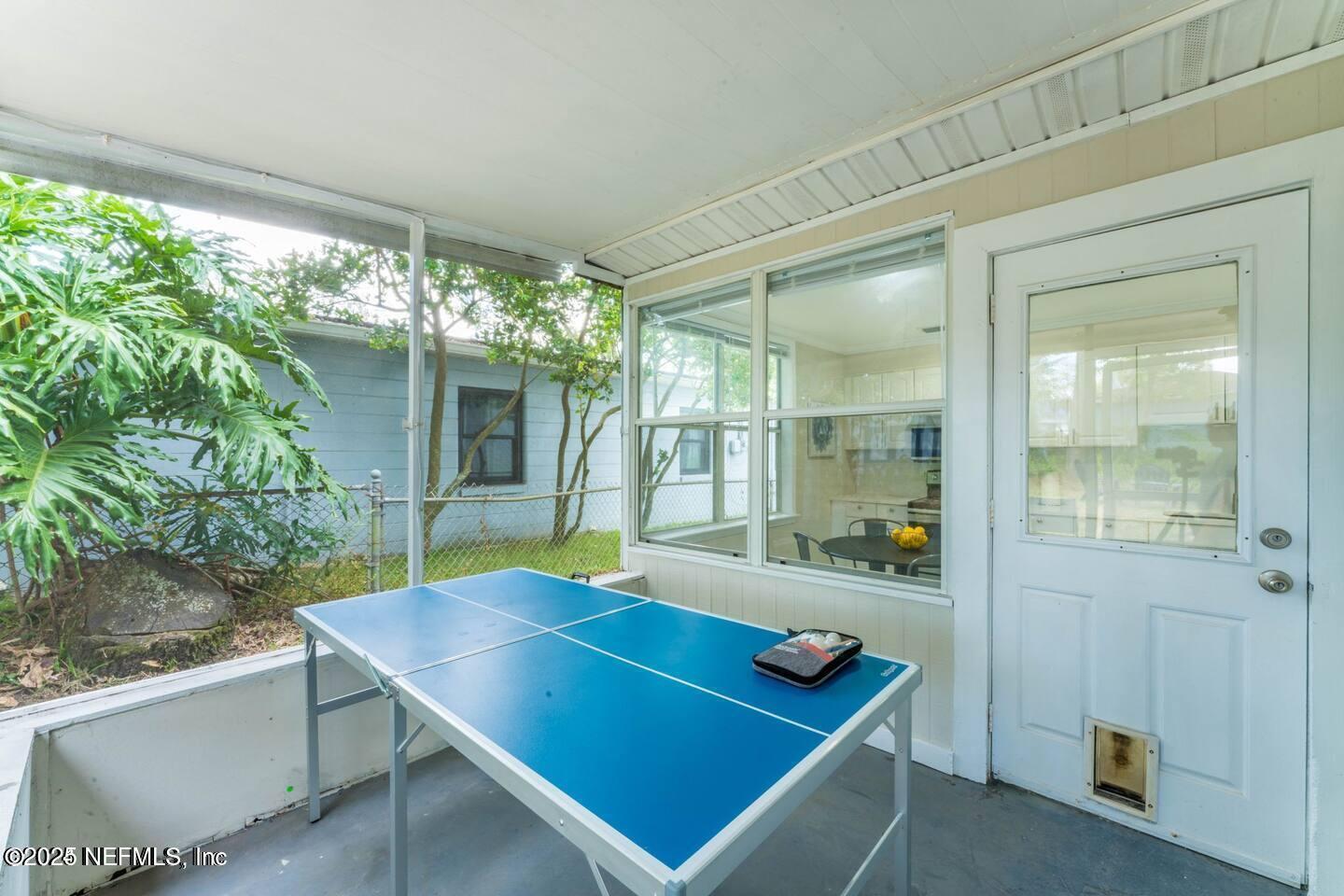 1247 Rensselaer Avenue Jacksonville, FL 32205 - Photo 20 of 24 a room with pool table and windows