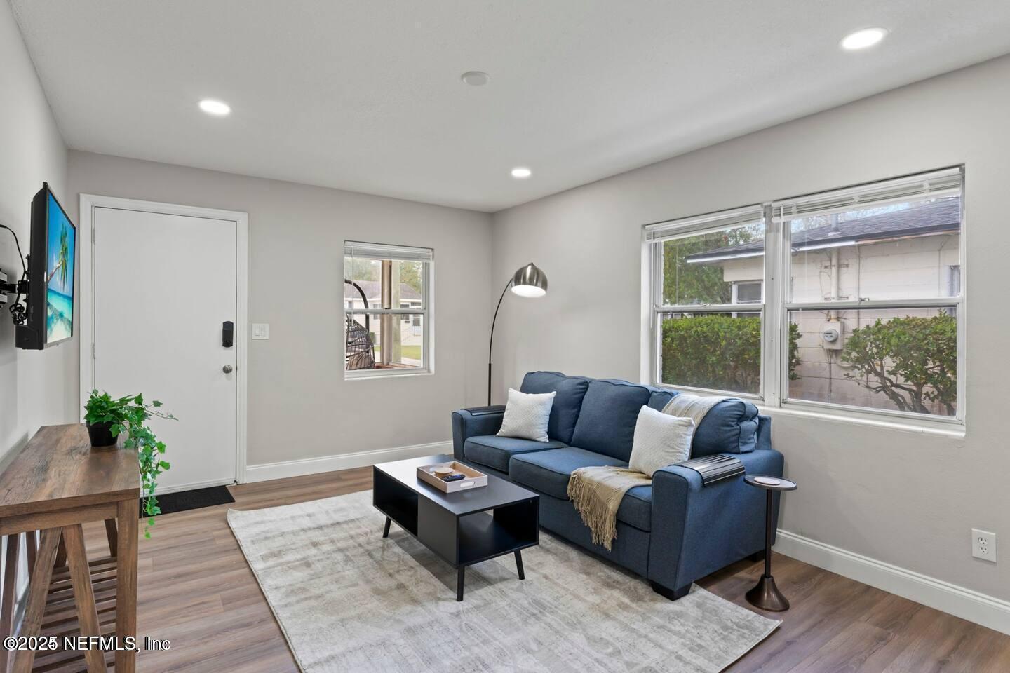 1247 Rensselaer Avenue Jacksonville, FL 32205 - Photo 5 of 24 a living room with furniture and a window