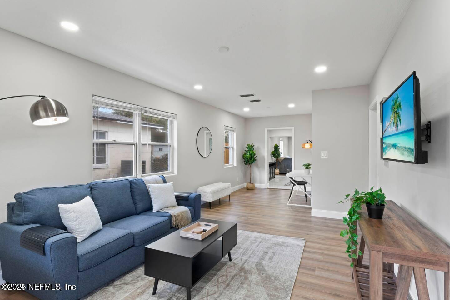 1247 Rensselaer Avenue Jacksonville, FL 32205 - Photo 6 of 24 a living room with furniture and wooden floor