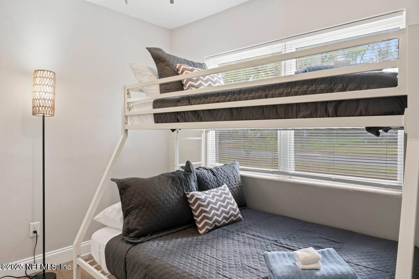 1247 Rensselaer Avenue Jacksonville, FL 32205 - Photo 8 of 24 a bedroom with a bed and a window