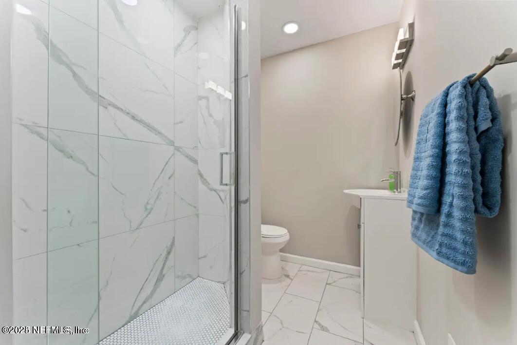 1247 Rensselaer Avenue Jacksonville, FL 32205 - Photo 10 of 24 a bathroom with a shower and toilet