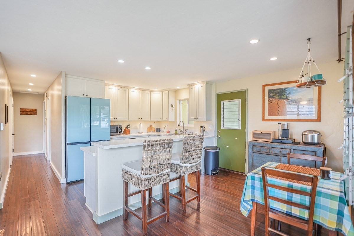 8778 Kekaha Road Kekaha, HI 96752 - Photo 5 of 18 a kitchen with a table and chairs in it