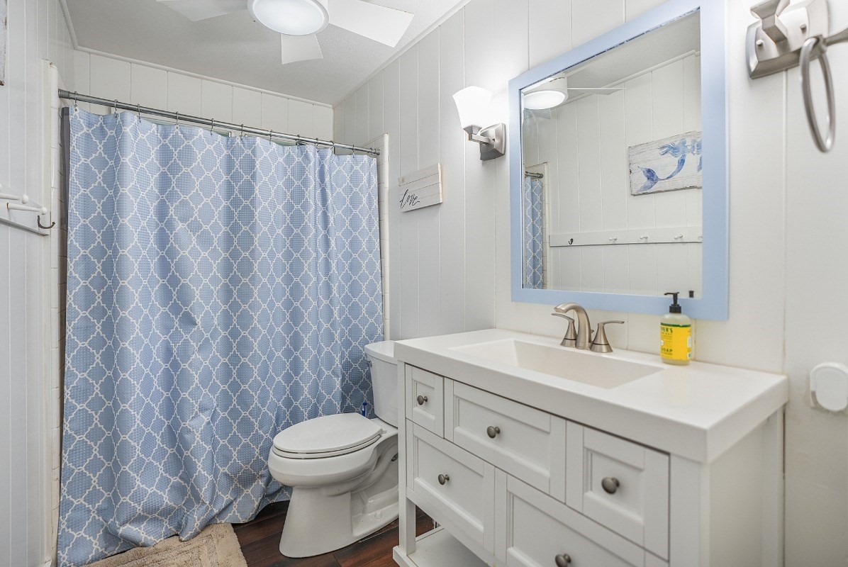 8778 Kekaha Road Kekaha, HI 96752 - Photo 9 of 18 a bathroom with a sink a toilet and a mirror