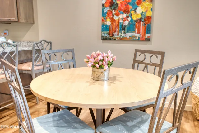 a view of a dining room with furniture and wooden floor