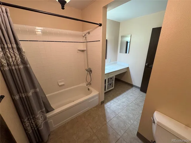 a view of bathroom with a washer and dryer