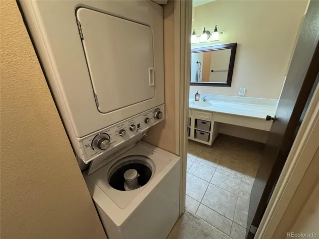 a view of balcony with wooden floor and fence